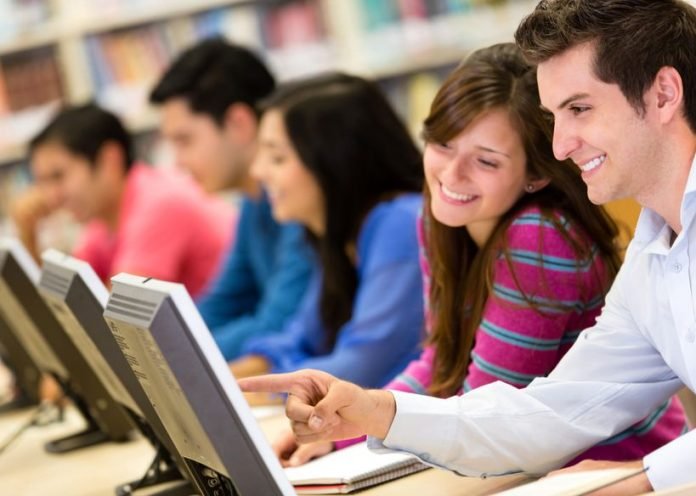 14231689 - group of college students in a computer lab